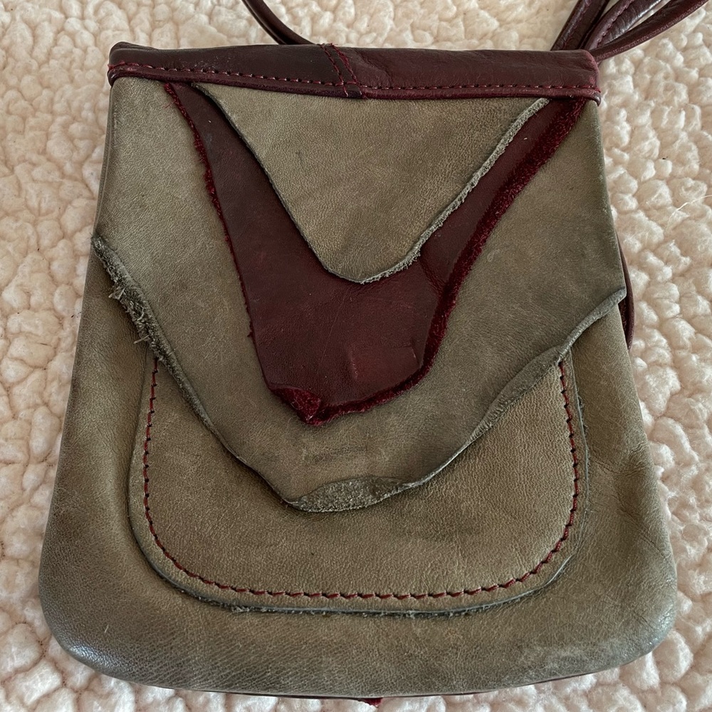 Handmade leather crossbody purse.